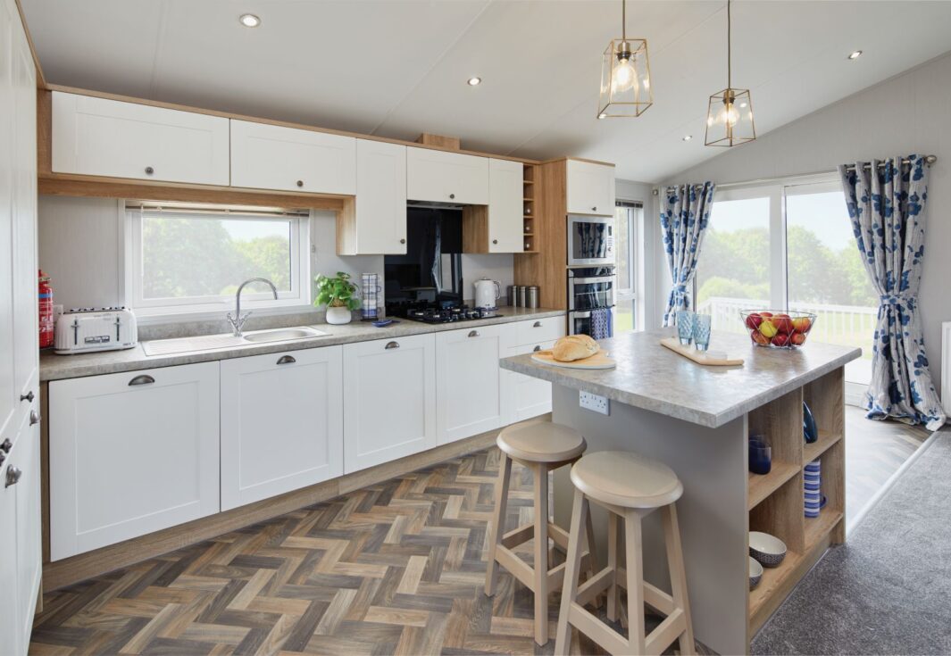 New Willerby Pinehurst twin lodge static caravan kitchen with breakfast bar