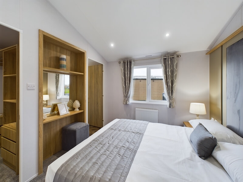 New Willerby Pinehurst twin lodge static caravan master bedroom