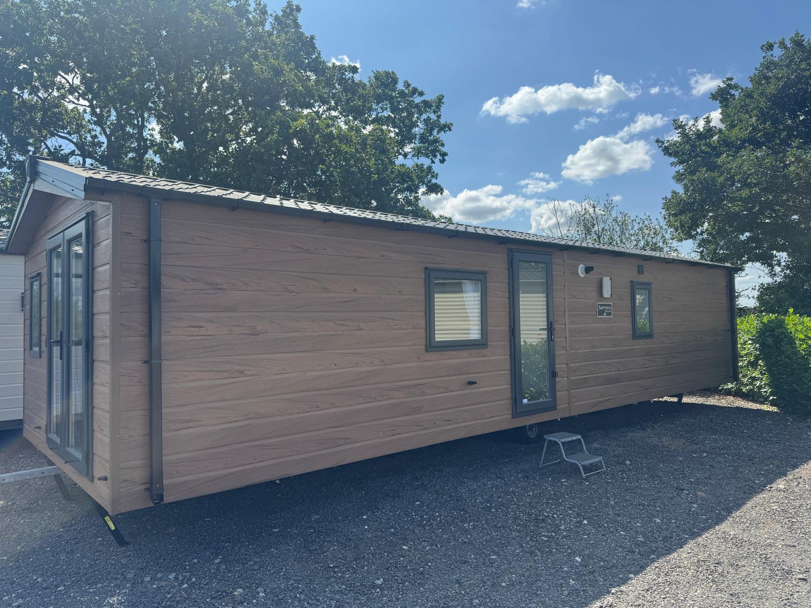 Delta Saffron Lodge tawny cladding with graphite windows